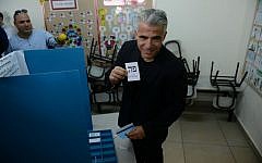 Yair Lapid casts his vote at a polling station in Tel Aviv on March 17, 2015. (Ben Kelmer/Flash90)