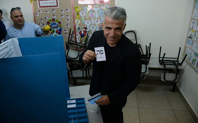 Yair Lapid casts his vote at a polling station in Tel Aviv on March 17, 2015. (Ben Kelmer/Flash90) Yair Lapid casts his vote at a polling station in Tel Aviv on March 17, 2015. (Ben Kelmer/Flash90)