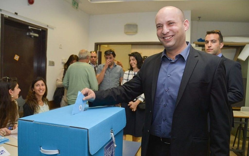 Economy Minister Naftali Bennett, leader of the Jewish Home party, casts his vote in general elections in in Ra’anana, March 17, 2015. (photo credit: Flash90)