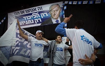Likud supporters celebrate at party headquarters in Tel Aviv on March 18, 2015. (Miriam Alster/Flash90)