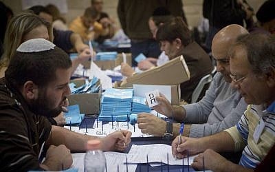 Officials count the final ballots, from soldiers and absentees, a day after the general elections, March 18, 2015. (Miriam Alster/Flash90