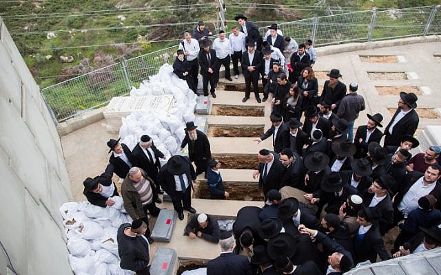 Mourners attend the funeral of the seven children from the Sassoon family in Jerusalem on March 23, 2015. (photo credit: Yonatan Sindel/Flash90) Mourners attend the funeral of the seven children from the Sassoon family in Jerusalem on March 23, 2015. (photo credit: Yonatan Sindel/Flash90)