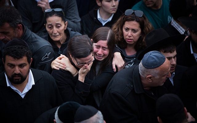 Mourners attend the funeral of the seven children from the Sassoon family in Jerusalem on March 23, 2015. (photo credit: Yonatan Sindel/Flash90) Mourners attend the funeral of the seven children from the Sassoon family in Jerusalem on March 23, 2015. (photo credit: Yonatan Sindel/Flash90)