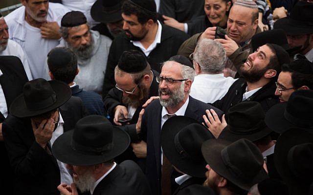 Gabriel Sassoon at the funeral of his seven children in Jerusalem on March 23, 2015. (photo credit: Yonatan Sindel/Flash90)