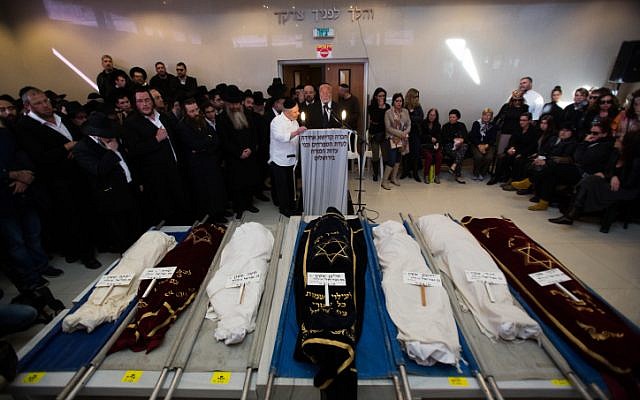 The funerals of the seven Sassoon children, who were killed in a deadly fire, in Jerusalem on March 23, 2015 (photo credit: Yonatan Sindel/Flash90) The funerals of the seven Sassoon children, who were killed in a deadly fire, in Jerusalem on March 23, 2015 (photo credit: Yonatan Sindel/Flash90)