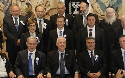 Prime Minister Benjamin Netanyahu and President Reuven Rivlin pose with heads of political parties and other officials after the opening session of the 20th Knesset on March 31, 2015. (Miriam Alster/Flash90)