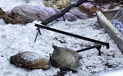 Debris lies scattered behind the house at the scene of a fire in the Brooklyn borough of New York that killed seven siblings, March 21, 2015. (photo credit: AP/Craig Ruttle) 