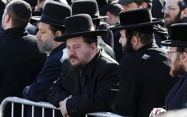 Mourners gather during funeral services for the seven siblings killed in a house fire, Sunday, March 22, 2015, in the Brooklyn borough of New York. (photo credit: AP/Julio Cortez)