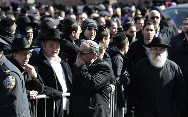 Mourners attend funeral services for the seven siblings killed in a house fire, Sunday, March 22, 2015, in the Brooklyn borough of New York. (photo credit: AP/Julio Cortez)