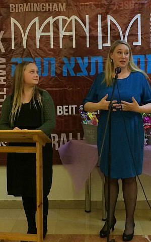 Hannah Bentow looks on as her mother Mette speaks at Hannah's bat mitzvah party in Jerusalem, March 12, 2015. (photo credit: Renee Ghert-Zand/Times of Israel staff)
