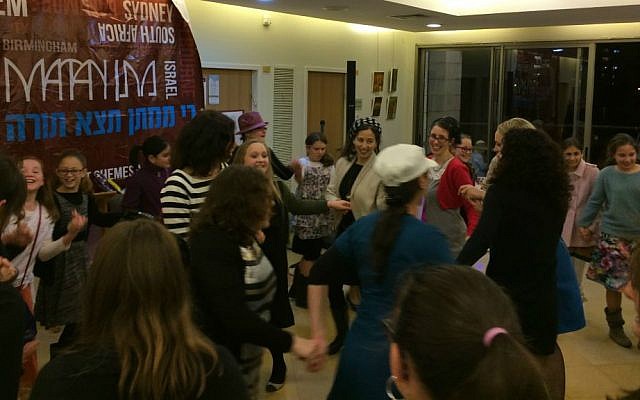 Hannah Bentow dances with guests at her bat mitzvah party in Jerusalem, March 12, 2015. (photo credit: Renee Ghert-Zand/Times of Israel staff)