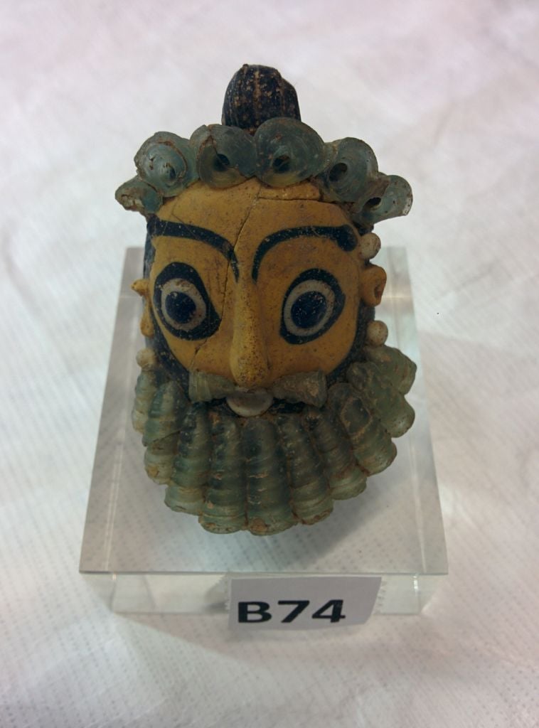 A Punic head pendant, part of the Belfer Collection going on display at the Israel Museum in June. (photo credit: Ilan Ben Zion/Times of Israel staff) A Punic head pendant, part of the Belfer Collection going on display at the Israel Museum in June. (photo credit: Ilan Ben Zion/Times of Israel staff)