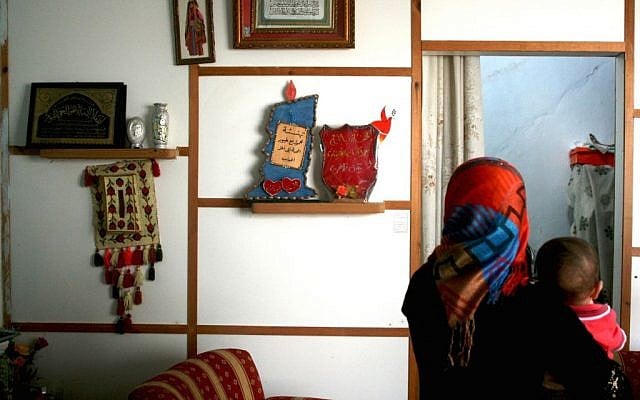 A craftswoman at Om Ahmed's house (photo credit: Shaina Shealy/Times of Israel) A craftswoman at Om Ahmed's house (photo credit: Shaina Shealy/Times of Israel)