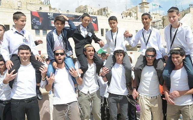 Boys who have been orphaned celebrate their bar mitzva together at the Western Wall in an event organized by Colel Chabad (Photo credit: Kobi Amsalem) Boys who have been orphaned celebrate their bar mitzva together at the Western Wall in an event organized by Colel Chabad (Photo credit: Kobi Amsalem)