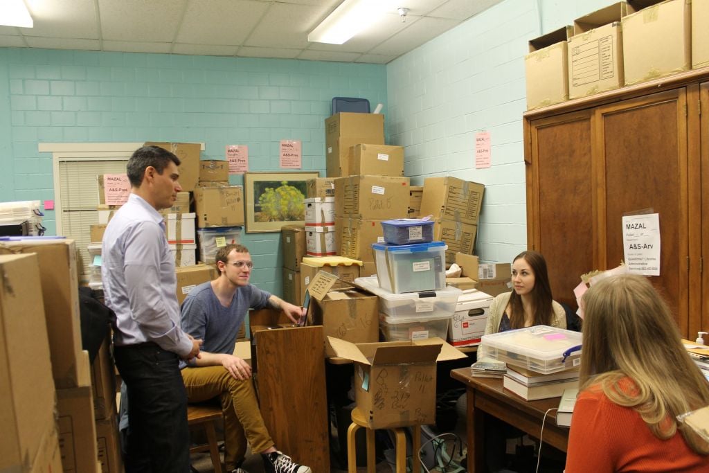 Professor David Shneer, left, talking with students at the University of Colorado-Boulder working on categorizing the materials in the Mazal Holocaust Collection, February 2015. (Uriel Heilman/JTA) Professor David Shneer, left, talking with students at the University of Colorado-Boulder working on categorizing the materials in the Mazal Holocaust Collection, February 2015. (Uriel Heilman/JTA)