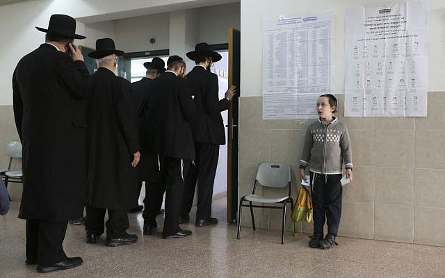 Ultra-Orthodox Jews line up to vote in Bnei Brak, Israel, Tuesday, March 17, 2015. (photo credit: AP Photo/Oded Balilty)