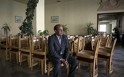 Ahmad Amarat, manager of the Kings' Way Hotel, speaks during an interview with The Associated Press in the ancient city of Petra, Jordan. "We are not optimistic for 2015," Amarat said. The hotel closed four months ago after an average occupancy rate of 28 percent for 2014, compared to 95 percent in 2010. March 24, 2015 (photo credit: AP/Raad Adayleh) Ahmad Amarat, manager of the Kings' Way Hotel, speaks during an interview with The Associated Press in the ancient city of Petra, Jordan. "We are not optimistic for 2015," Amarat said. The hotel closed four months ago after an average occupancy rate of 28 percent for 2014, compared to 95 percent in 2010. March 24, 2015 (photo credit: AP/Raad Adayleh)