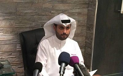 Kuwaiti lawyer Salem al-Hashash, former attorney for the father of Mohammed Emwazi, unmasked as "Jihadi John" last month, talks to reporters in his office in Kuwait City on Sunday, March 8, 2015. (AP Photo/Hussain al-Qatari)