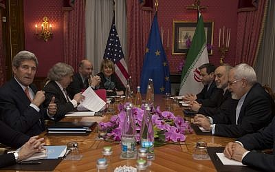 US Secretary of State John Kerry, left, holds a negotiation meeting with Iran's Foreign Minister Javad Zarif, seated opposite, over Iran's nuclear program, in Lausanne, Switzerland on Thursday, March 19, 2015. (photo credit: AP/Brian Snyder, Pool)