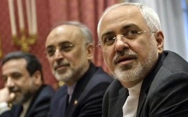 Iranian Foreign Minister Mohammad Javad Zarif (right), waits for the start of a meeting with a US delegation to multilateral nuclear talks at a hotel in Lausanne, Switzerland, on March 26, 2015. (photo credit: AP/Brendan Smialowski) Iranian Foreign Minister Mohammad Javad Zarif (right), waits for the start of a meeting with a US delegation to multilateral nuclear talks at a hotel in Lausanne, Switzerland, on March 26, 2015. (photo credit: AP/Brendan Smialowski)