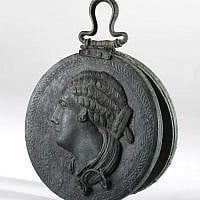 Bronze mirror with a woman's head in relief, Hellenistic period, late 4th–3rd century BCE from the Belfer Collection (photo credit: © The Israel Museum Jerusalem, Elie Posner)