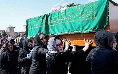 Afghan women rights activists carry the coffin of 27-year-old Farkhunda, an Afghan woman who was beaten to death by a mob, during her funeral, in Kabul, Afghanistan, Sunday, March 22, 2015. ( photo credit: AP Photo/Massoud Hossaini)