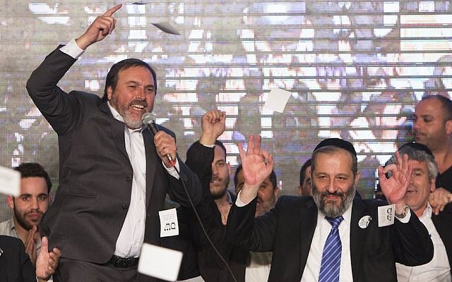 Shas Chairman Aryeh Deri, on right, celebrating exit poll results, March 17, 2015. Shas made alleviating poverty a centerpiece of its 2015 campaign. (photo credit: Yonatan Sindel/Flash90) Shas Chairman Aryeh Deri, on right, celebrating exit poll results, March 17, 2015. Shas made alleviating poverty a centerpiece of its 2015 campaign. (photo credit: Yonatan Sindel/Flash90)