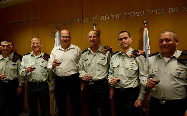 A General Staff changing of the guard on March 24, 2015, from right: Chief of the IDF General Staff Lt. Gen. Gadi Eisenkot; incoming head of the Home Front Command, Maj. Gen. Yoel Strik; outgoing Home Front Command head Maj. Gen. Eyal Eisenberg; Defense Minister Moshe Ya'alon; outgoing OC Central Command, Maj. Gen. Nitzan Alon; incoming OC Central Command, Maj. Gen. Roni Numa (photo credit: IDF Spokesperson's Unit) A General Staff changing of the guard on March 24, 2015, from right: Chief of the IDF General Staff, Lt. Gen. Gadi Eisenkot; incoming head of the Home Front Command, Maj. Gen. Yoel Strik; outgoing Home Front Command head Maj. Gen. Eyal Eisenberg; Defense Minister Moshe Ya'alon; outgoing OC Central Command, Maj. Gen. Nitzan Alon; incoming OC Central Command, Maj. Gen. Roni Numa (photo credit: IDF Spokesperson's Unit)