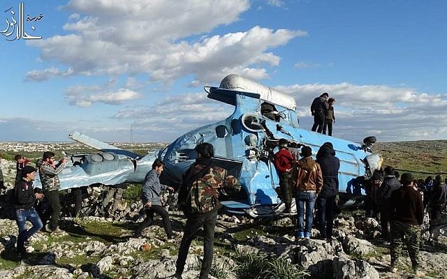Illustrative: A Syrian helicopter crashes in rebel-held territory in Idlib province, March 22, 2015. (Idlib Media Center/Facebook) Illustrative: A Syrian helicopter crashes in rebel-held territory in Idlib province, March 22, 2015. (Idlib Media Center/Facebook)