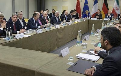 Participants to the Iranian nuclear talks meet at the Beau-Rivage Palace Hotel in Lausanne, Switzerland, on March 30, 2015. (photo credit: AFP/Brendan Smialowski, Pool)