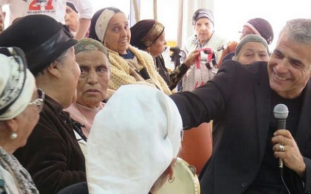 Yair Lapid at a day care center for the elderly in Rosh Ha'ayin, March 9, 2015. (Courtesy)