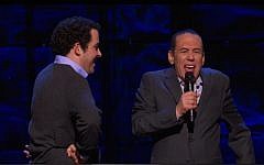 Owen Suskind (left) and Gilbert Gottfried on stage in New York at 'The Night of Too Many Stars,' March 7, 2015 (Photo credit: Screenshot)