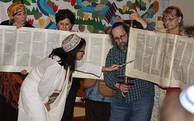 Rabbi Ariel Stone, in white, and the congregants of Shir Tikvah, the only synagogue on Portland’s east side. (Gary Teasdale/JTA)