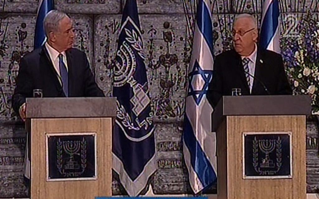 Prime Minister Benjamin Netanyahu and President Reuven Rivlin at the President's Residence on March 25, 2015, as Rivlin formally charges Netanyahu with forming the next government. (Channel 2 screenshot)