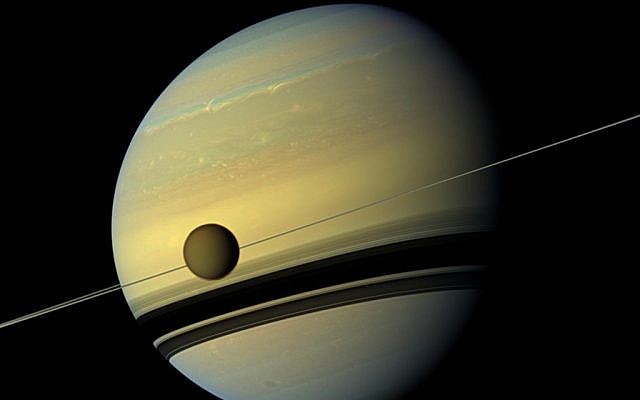 Saturn and its moon Titan. (photo credit: NASA/JPL-Caltech/SSI) Saturn and its moon Titan. (photo credit: NASA/JPL-Caltech/SSI)