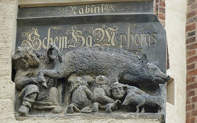 This carving on the facade of Martin Luther's church in Wittenberg, Germany shows Jews suckling at a sow's teat. (Toni L. Kamins/JTA) This carving on the facade of Martin Luther's church in Wittenberg, Germany shows Jews suckling at a sow's teat. (Toni L. Kamins/JTA)