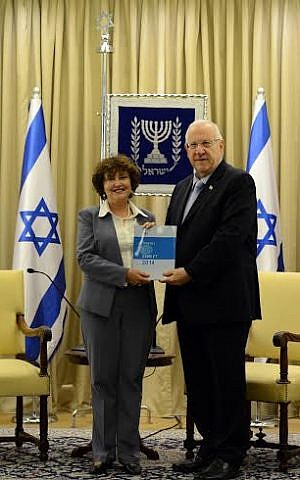 President Reuven Rivlin accepts the Bank of Israel's annual report for 2014 from Governor Karnit Flug, on March 31, 2015.  (photo credit: Haim Zach GPO)