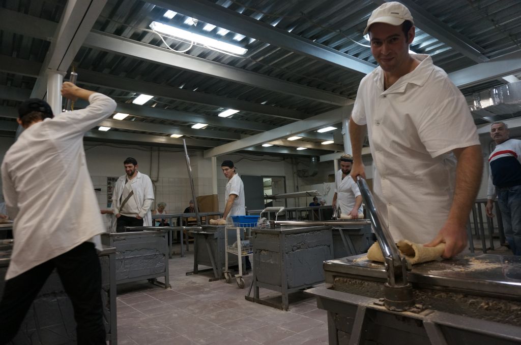 Binyamin Vestrikov, right, with other workers at the Tiferet Hamatzot factory in Dnepropetrovsk, Ukraine, Dec. 8, 2014. (Cnaan Liphshiz/JTA) Binyamin Vestrikov, right, with other workers at the Tiferet Hamatzot factory in Dnepropetrovsk, Ukraine, Dec. 8, 2014. (Cnaan Liphshiz/JTA)