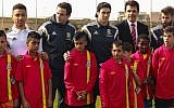 Welsh Football Team plays coexistence football with Jewish and Arab children from northern communities in Israel. The children were handed Welsh football team shirts by the players and manager Chris Coleman. R-L: Joe Ledley, Chris Coleman and Gareth Bale. (photo credit: Kobi Wolf)