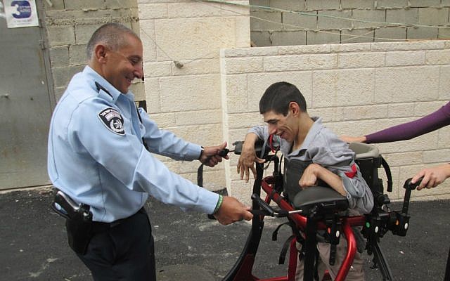 Police officers from Jerusalem's Lev Habira station have been training ALEH residents for the Jerusalem Marathon for months. (Courtesy of ALEH Jerusalem) 