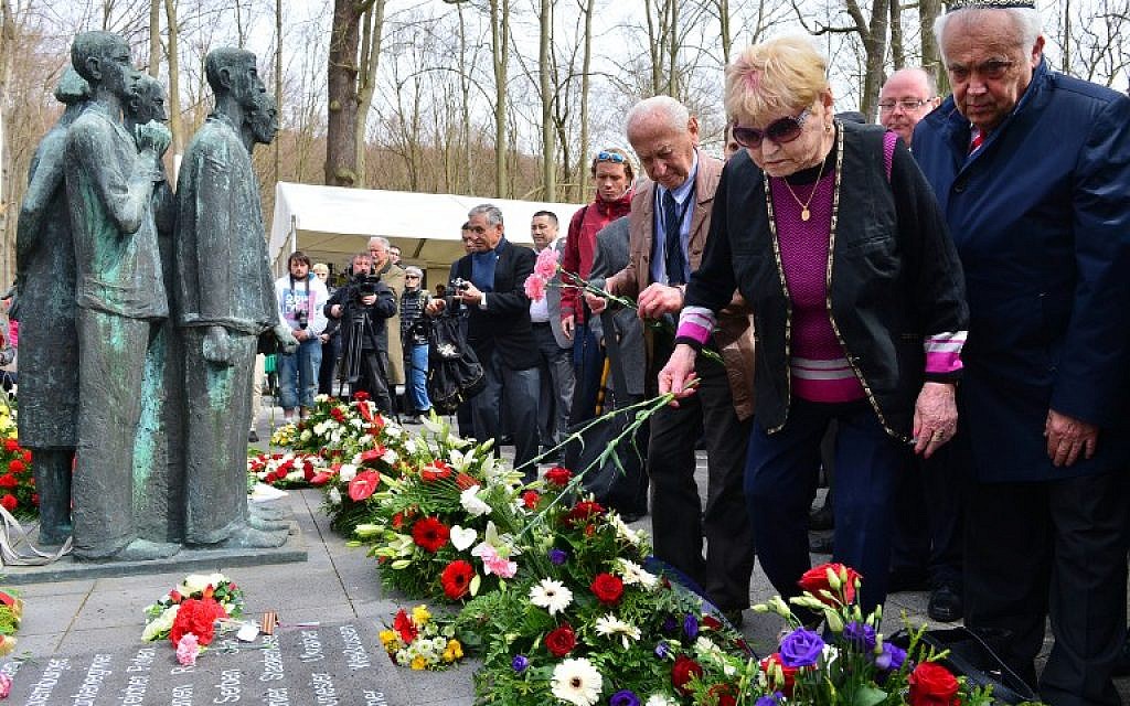 Participants attend a wreath ceremony during a commemorative event on the 70th anniversary of the liberation of concentration camp Mittelbau-Dora in Nordhausen, eastern Germany, on April 13, 2015. (photo credit: AFP/DPA/MARTIN SCHUTT)