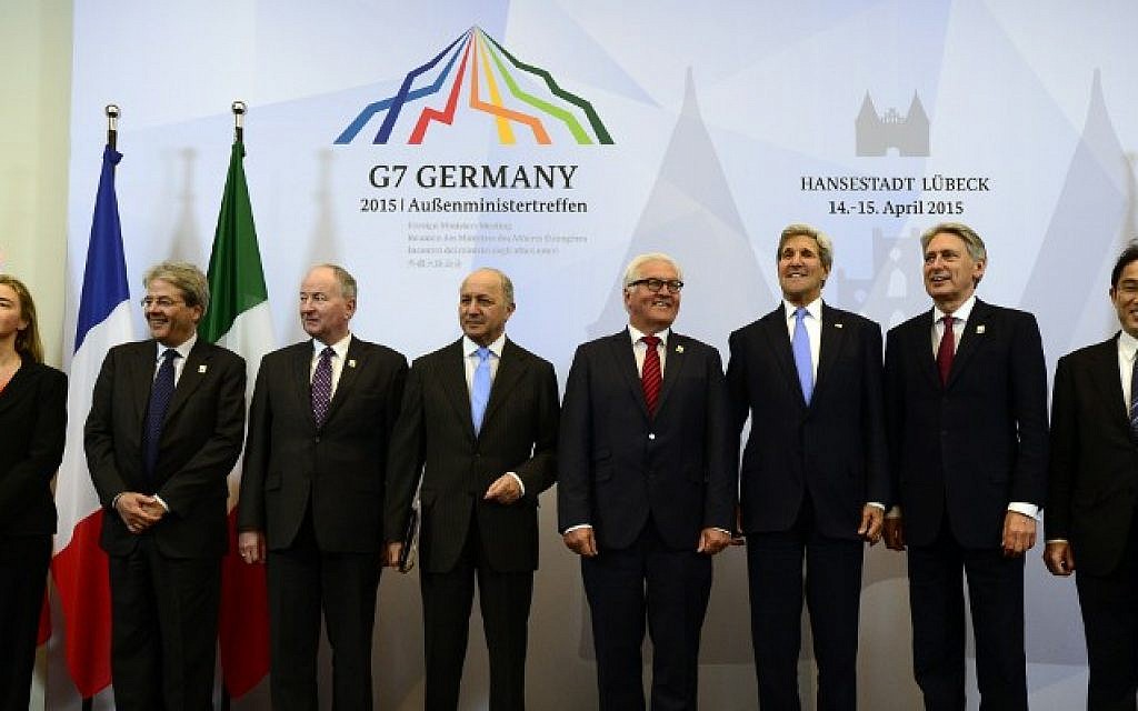 (L-R) High Representative of the European Union for Foreign Affairs and Security Policy Federica Mogherini, Italian Foreign Minister Paolo Gentiloni, Canadian Foreign Minister Rob Nicholson, French Foreign Minister Laurent Fabius, German Foreign Minister Frank-Walter Steinmeier, US Secretary of State John Kerry, British Foreign Secretary Philip Hammond and Japanese Foreign Minister Fumio Kishida pose for a family picture during a meeting of G7 foreign ministers in Luebeck, northern Germany, on April 15, 2015. (John Macdougall)