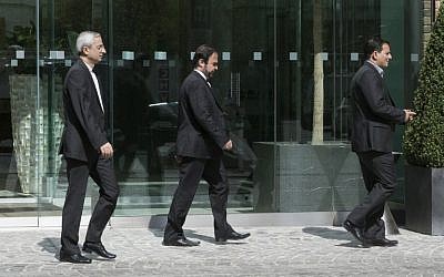 Iran's ambassador to the IAEA (International Atomic Energy Agency), Reza Najafi (C) leaves Coburg Palace during the E3/EU+3 and Iran talks in Vienna on April 22, 2015. (photo credit: AFP PHOTO / JOE KLAMAR)
