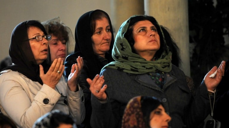 Women pray during a religious service at the cathedral in Etchmiadzin, outside Yerevan, on April 23, 2015, ahead of the canonization ceremony for the Martyrs of the Armenian Genocide. Armenians prepare to commemorate on April 24 a hundred years since 1.5 million of their kin were massacred by Ottoman forces, as a fierce dispute still rages with Turkey over Ankara's refusal to recognize the mass murder as genocide. (Photo credit: Karen Minasyan/AFP) Women pray during a religious service at the cathedral in Etchmiadzin, outside Yerevan, on April 23, 2015, ahead of the canonization ceremony for the Martyrs of the Armenian Genocide. Armenians prepare to commemorate on April 24 a hundred years since 1.5 million of their kin were massacred by Ottoman forces, as a fierce dispute still rages with Turkey over Ankara's refusal to recognize the mass murder as genocide. (Photo credit: Karen Minasyan/AFP)