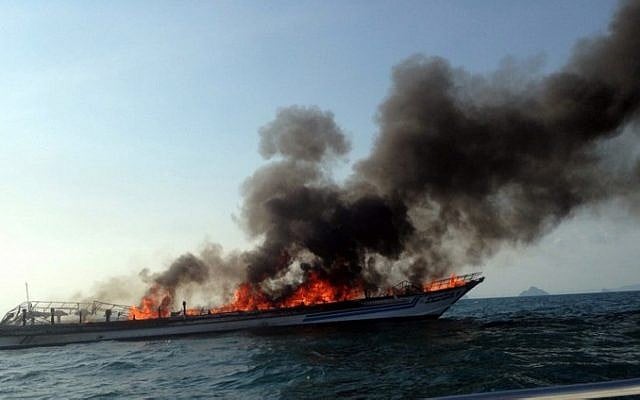 A general view shows the burning Phuket ferry near Noppharat Thara beach in Krabi province on April 8, 2015. (photo credit: AFP PHOTO) A general view shows the burning Phuket ferry near Noppharat Thara beach in Krabi province on April 8, 2015. (photo credit: AFP PHOTO)
