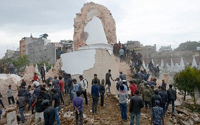 Nepalese rescue members and onlookers gather at the collapsed Dharahara Tower in Kathmandu on April 25, 2015. (photo credit: AFP/PRAKASH MATHEMA)