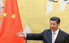 Chinese President Xi Jinping attends a signing ceremony with Ugandan President Yoweri Kaguta Museveni in the Great Hall of the People in Beijing on March 31, 2015. (photo credit: AFP  / FENG LI / POOL)