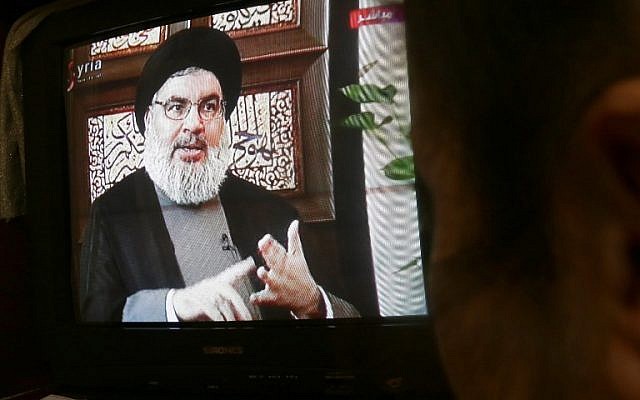 A Syrian watches an interview of Hassan Nasrallah screened on Syria's official television channel Al-Ikhbariya on April 6, 2015 in Damascus. (AFP/STR) A Syrian watches an interview of Hassan Nasrallah screened on Syria's official television channel Al-Ikhbariya on April 6, 2015 in Damascus. (AFP/STR)
