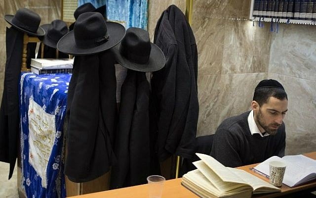An ultra-Orthodox Jewish student studies the Torah at a synagogue in the Mea Shearim neighborhood of Jerusalem, April 15, 2015. (AFP/MENAHEM KAHANA) An ultra-Orthodox Jewish student studies the Torah at a synagogue in the Mea Shearim neighborhood of Jerusalem, April 15, 2015. (AFP/MENAHEM KAHANA)