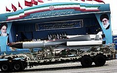 A S-200 surface-to-air missile system is driven past Iranian military commanders during the Army Day parade in Tehran on April 18, 2015. (Photo credit: Behrouz Mehri/AFP)